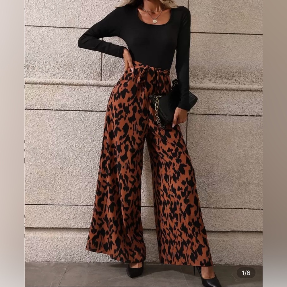 SHEIN Stylish Black and Orange Leopard Print jumpsuit.